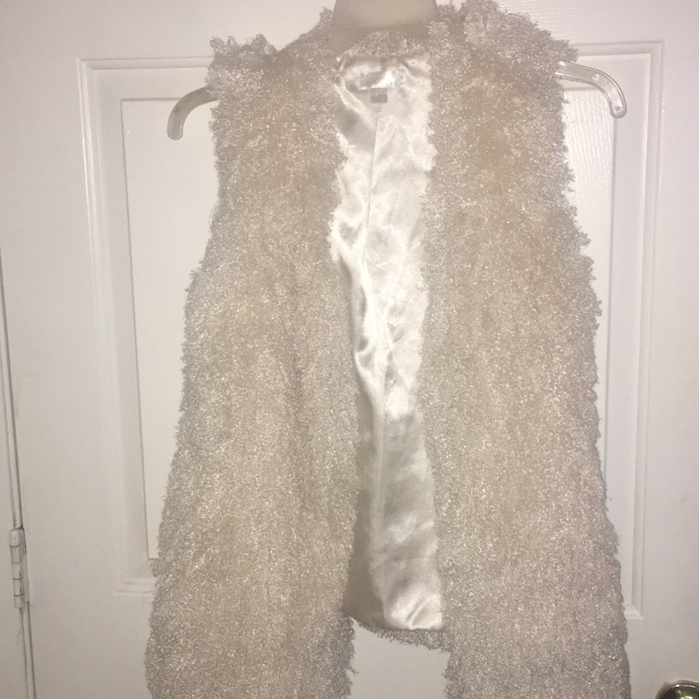 White fuzzy vest